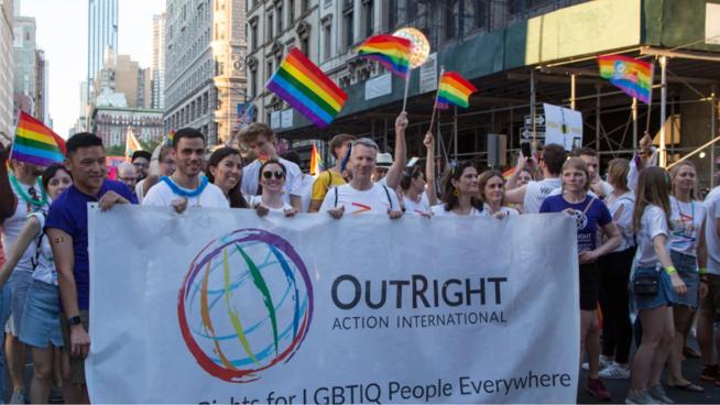 People Marching with rainbow flag 