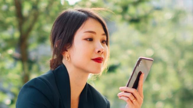 Asian woman using mobile phone