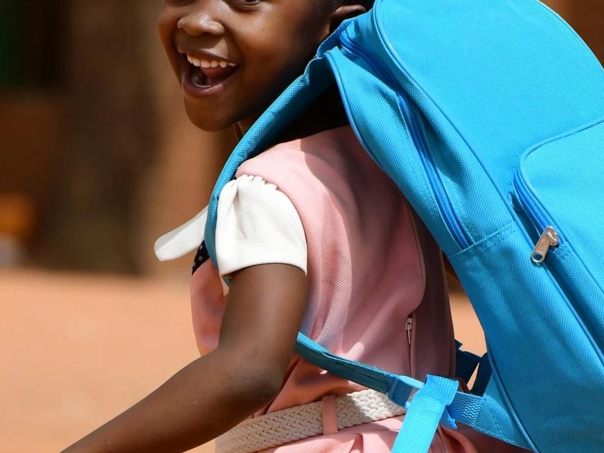 A girl wearing a UNICEF backpack
