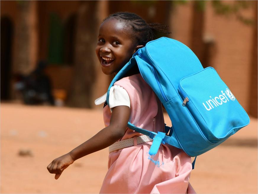 A girl wearing a UNICEF backpack